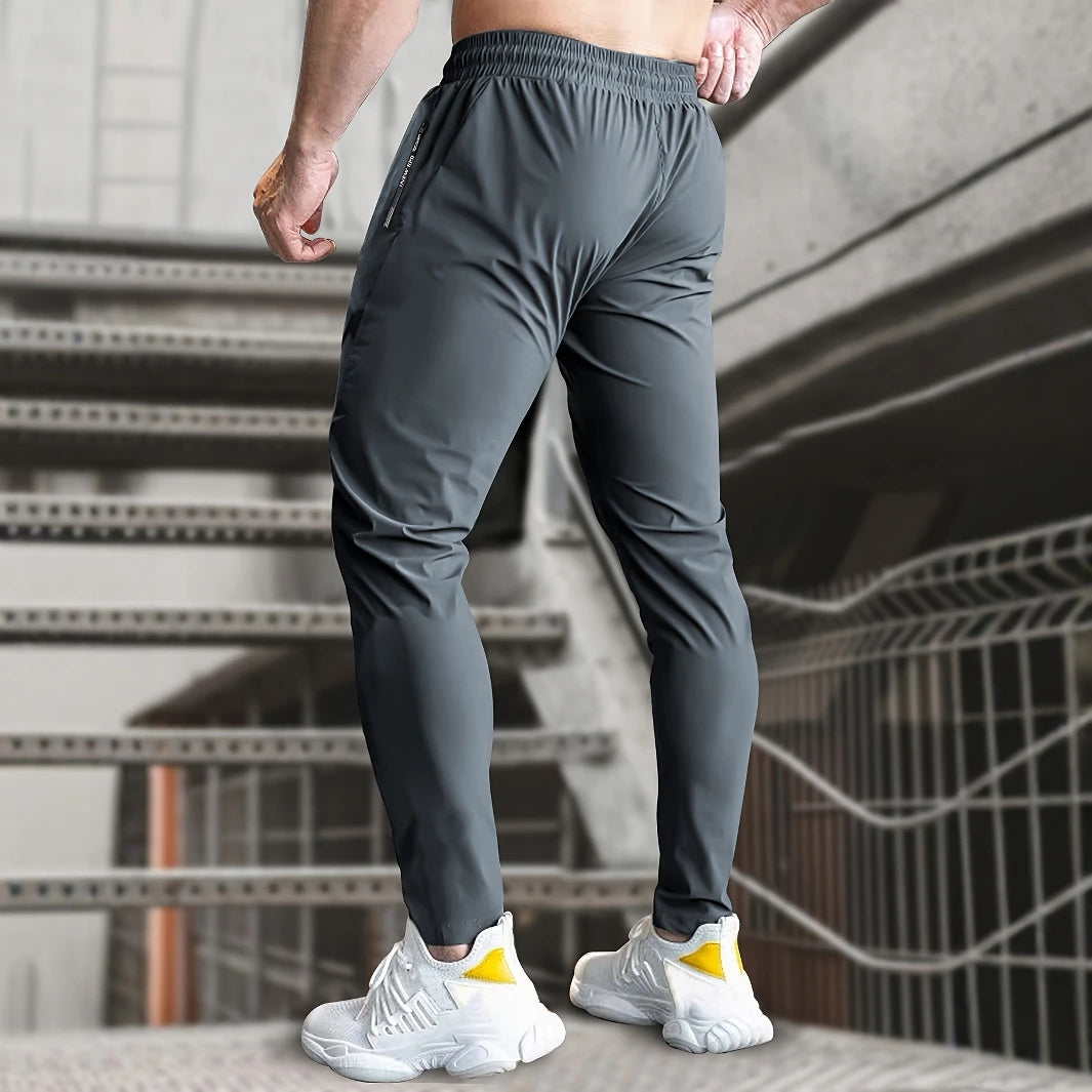 Men High Elasticity Ice Silky Joggers with Zipper Pockets Breathable Stretchy Athletic Pants for Running Gym and Outdoor Activit