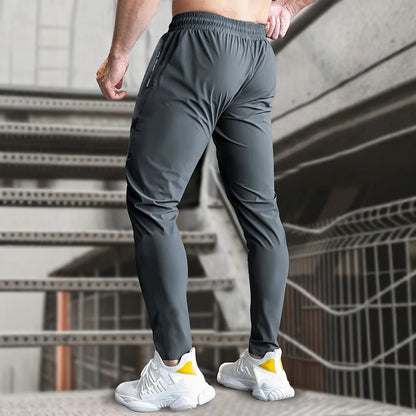 Men High Elasticity Ice Silky Joggers with Zipper Pockets Breathable Stretchy Athletic Pants for Running Gym and Outdoor Activit